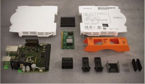 Base module RevPi Core 3 dismantled into its components. The Raspberry Pi Compute module is in the centre of the picture